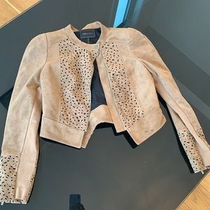 brown swade jacket with black detailing.